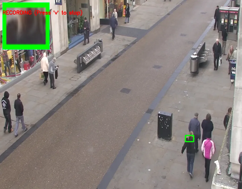 The tracker running on street footage: a green box locks onto a pedestrian while an inset panel shows the magnified tracked patch and a red RECORDING label