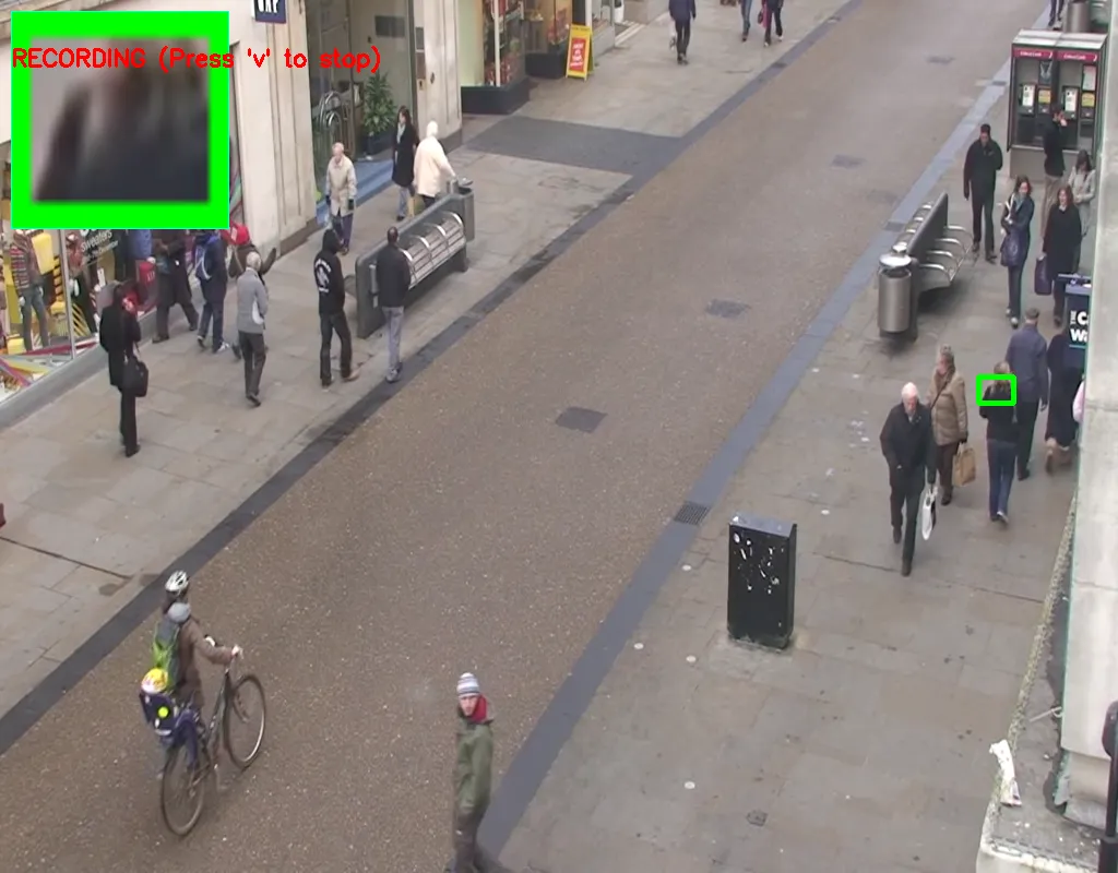 The same tracker several frames later, the green box still on the same pedestrian as they walk further down the street