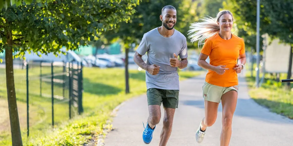 The photograph passed to the model: two runners on a tree-lined park path in summer