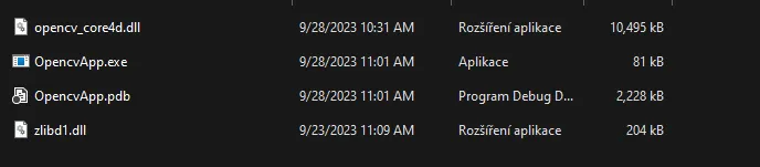 The output folder with OpencvApp.exe next to opencv_core4d.dll and zlibd1.dll, copied there automatically by vcpkg