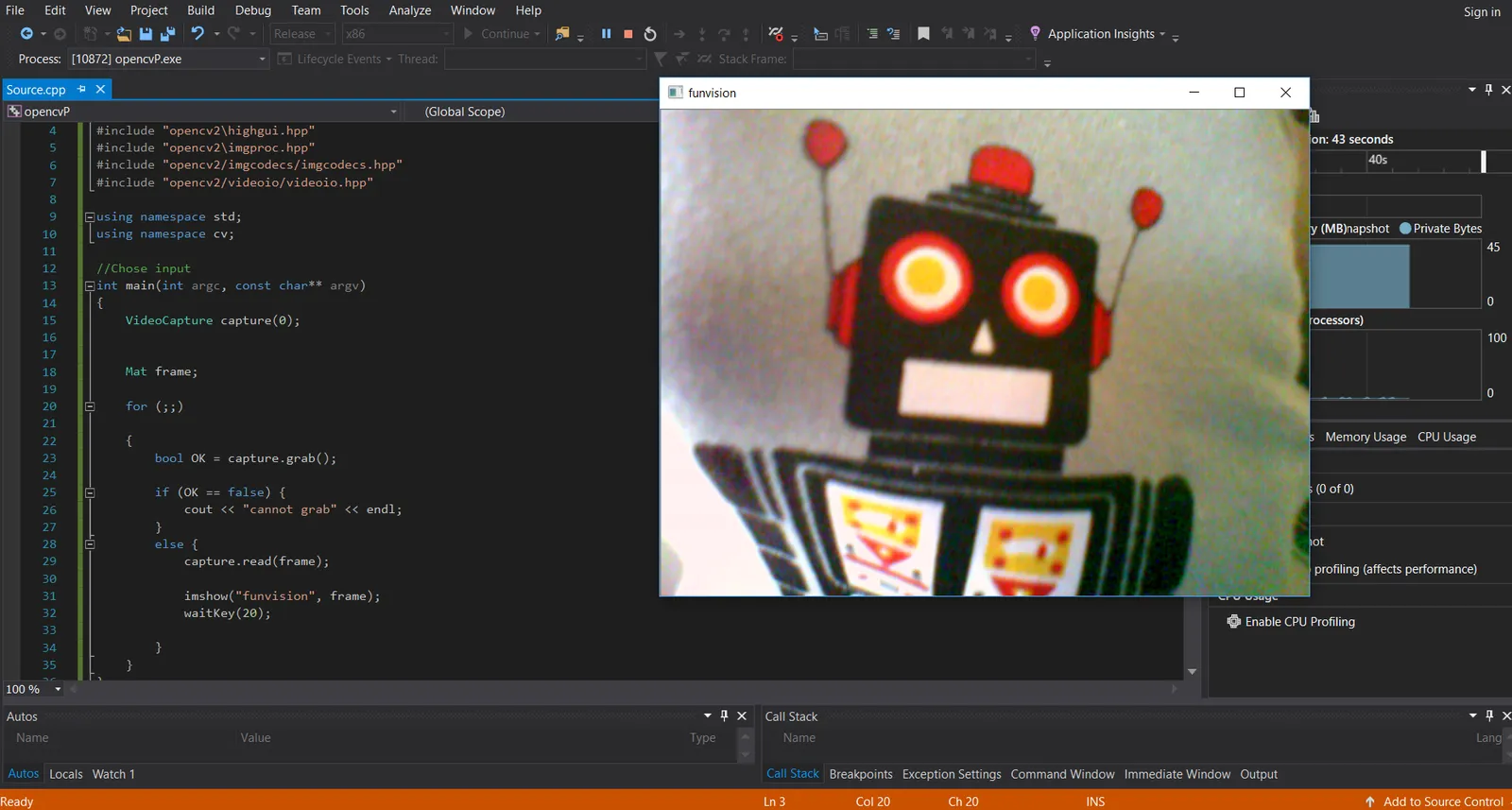 The program running from Visual Studio 2017, showing a webcam frame of a toy robot in a window titled funvision